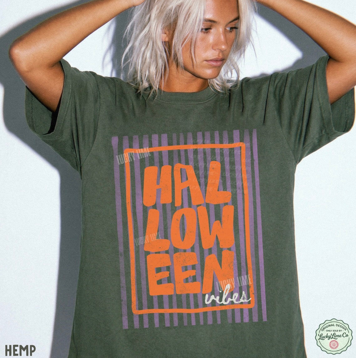 Person wearing a green t-shirt with 'HALLOWEEN vibes' text design.