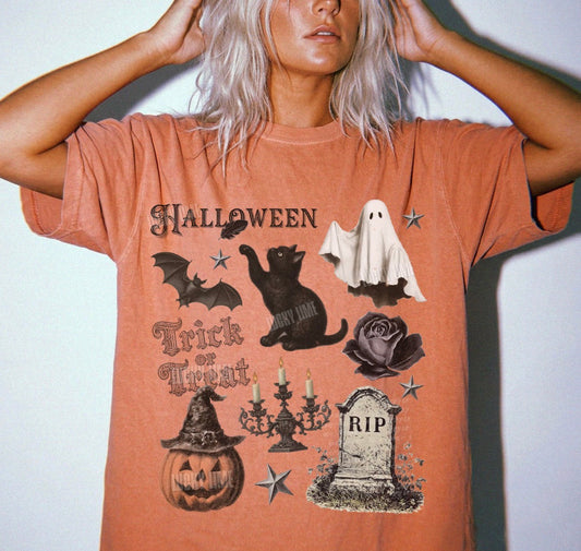 Person wearing a Halloween-themed t-shirt with various graphics on a plain background