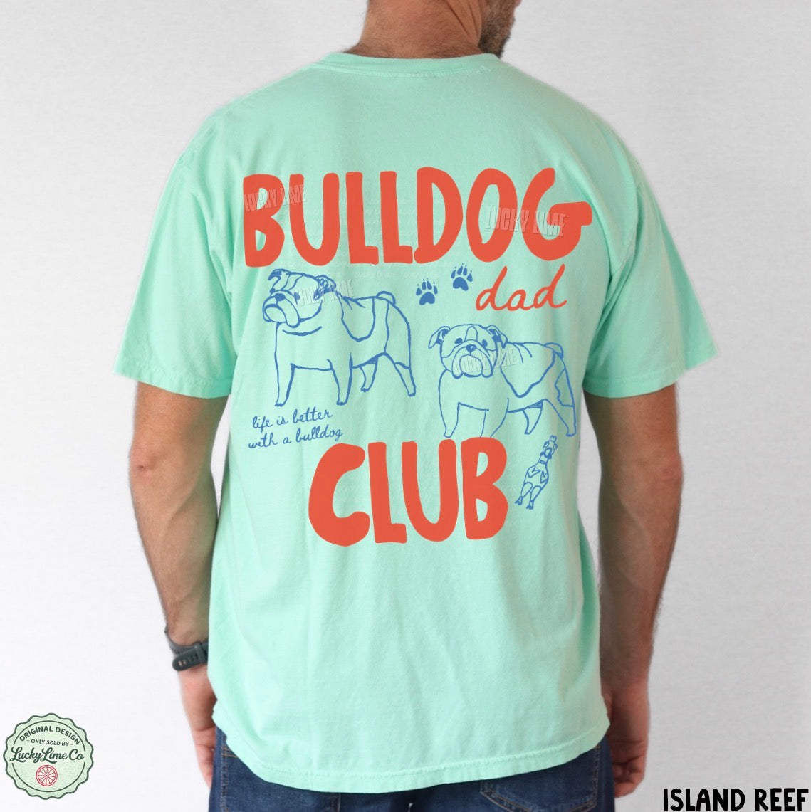 Person wearing a light green t-shirt with 'Bulldog Dad Club' text and graphics on the back.