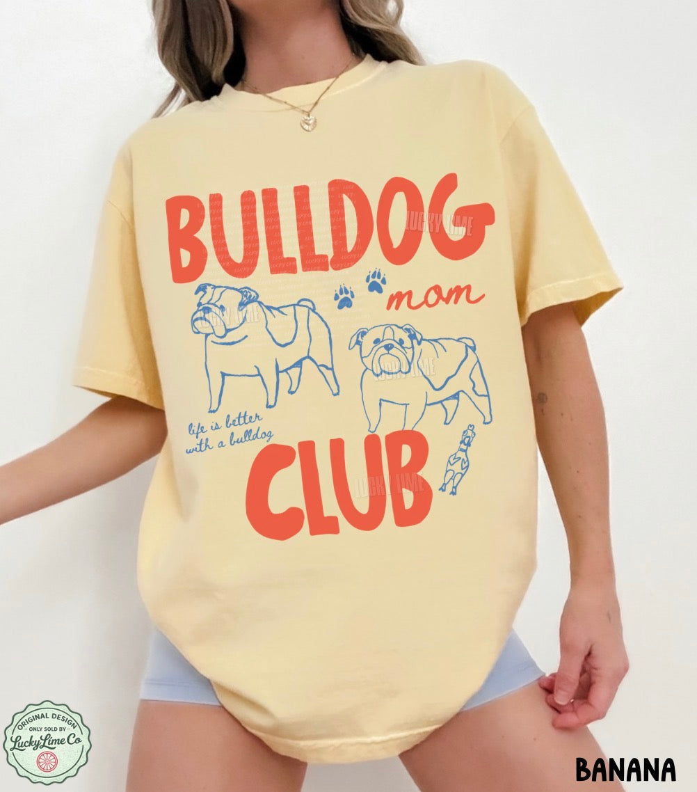 Person wearing a yellow t-shirt with 'Bulldog Mom Club' design on a white background