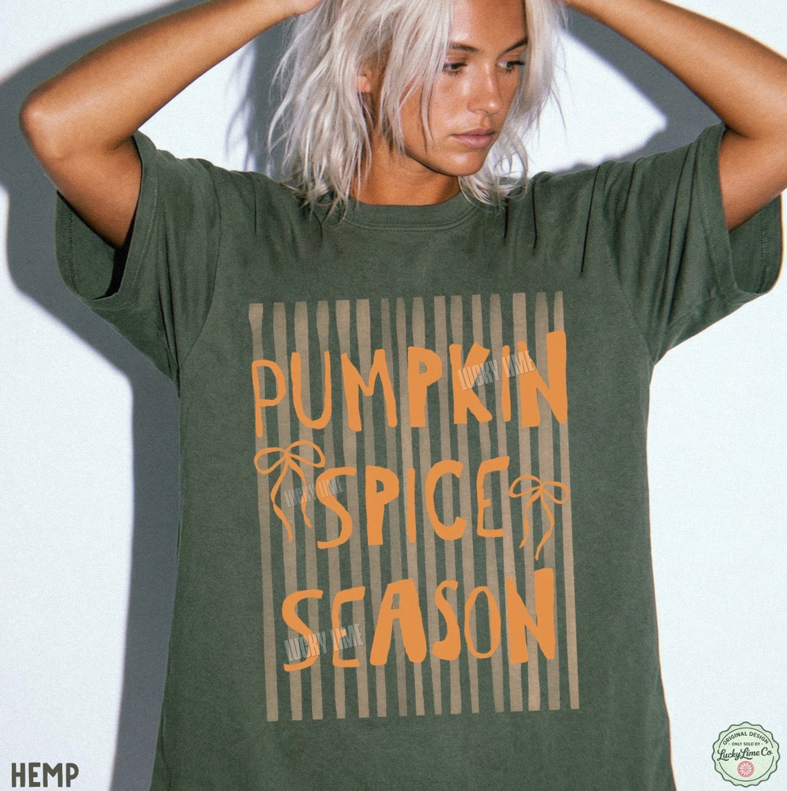 Person wearing a green t-shirt with 'Pumpkin Spice Season' text on a white background