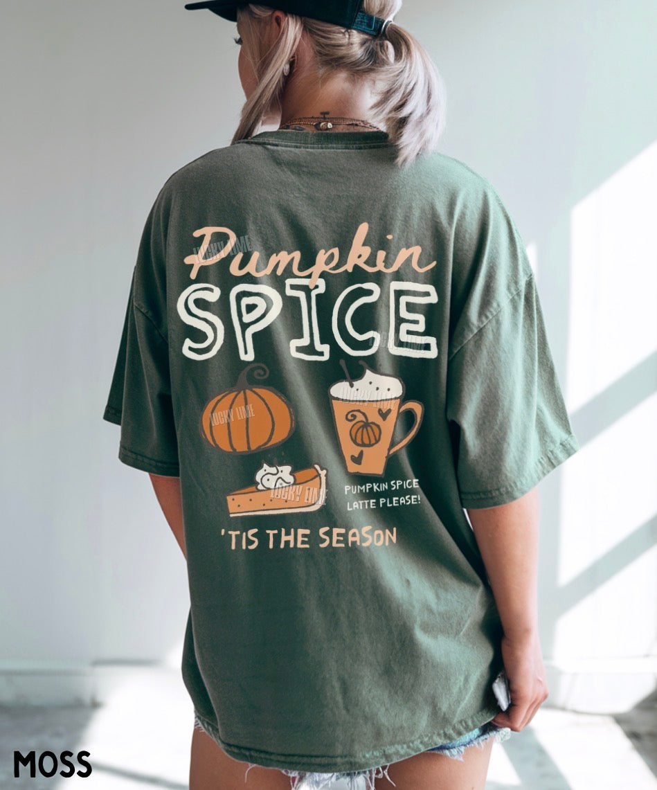 A woman viewed from behind wearing an oversized sage green t-shirt with a 'Pumpkin Spice' graphic on the back, featuring a pumpkin, mug, and slice of pie. The brand name 'MOSS' is visible in the bottom left corner.
