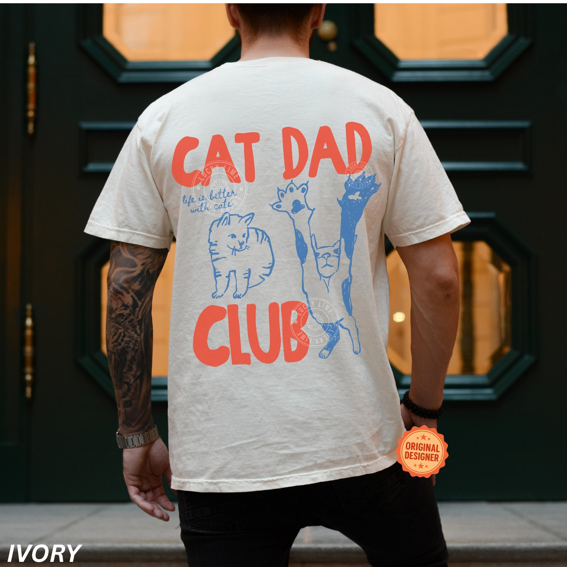 Person wearing a t-shirt with 'Cat Dad Club' design and text.